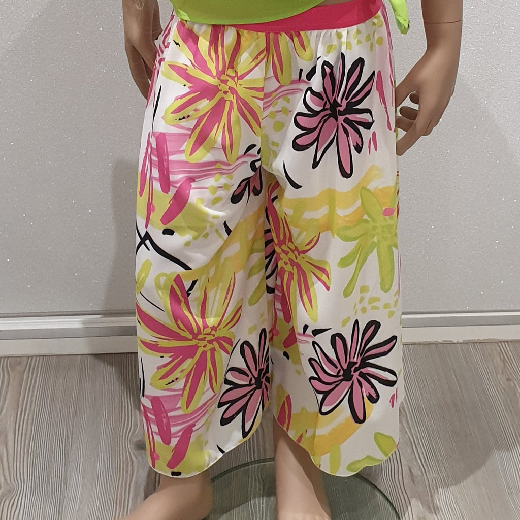 Pantalone bambina stile gaucho con fantasia fiori fluo